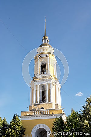 Workers painting the bell tower of the gate church at the Holy Trinity female orthodox monastery in Kolomna, Russia Editorial Stock Photo